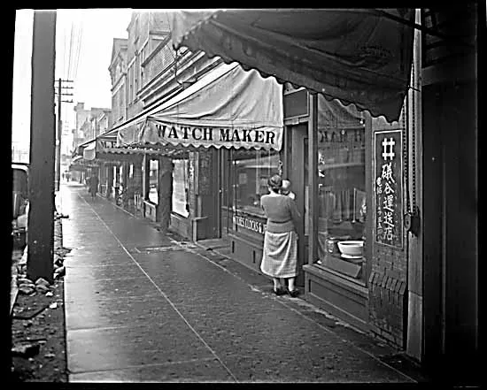 View of Powell Street in Japan Town Vancouver with watchmaker shop - 1928