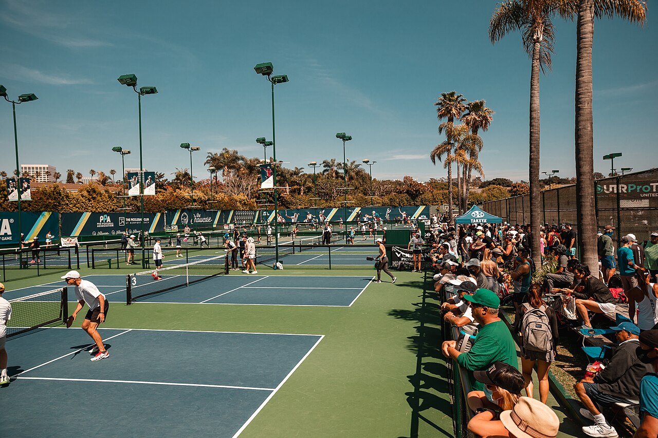 A shot of the professional and amateur courts at the Newport Beach Doubles Shootout (PPA).. Reference photograph; not represented as the Miami story venue or its named subjects..