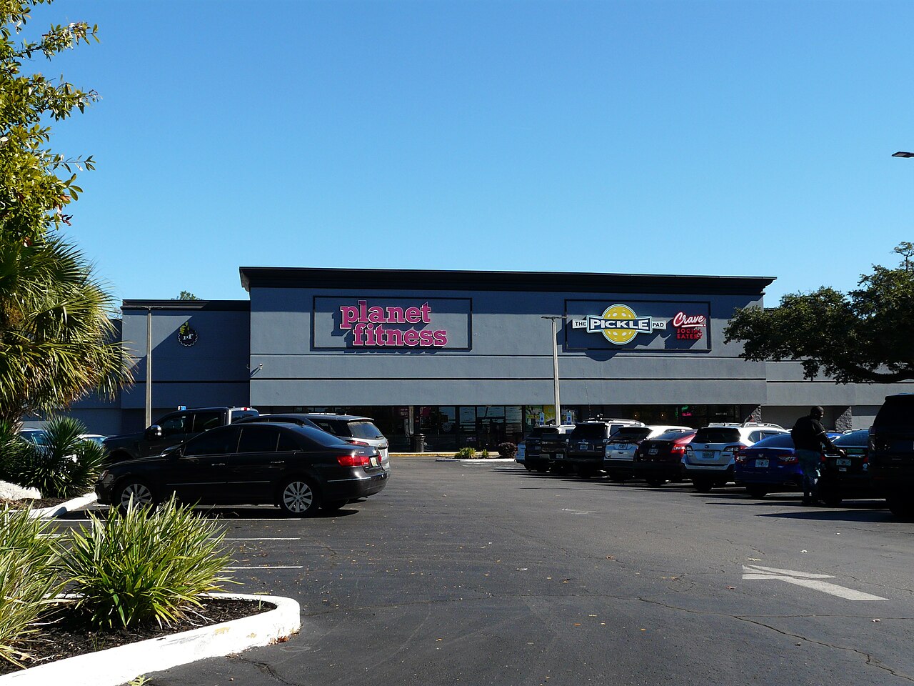 Planet Fitness and The Pickle Pad pickleball in a former Albertsons on North Monroe Street in Tallahassee, Florida.. Reference photograph; not represented as the Miami story venue or its named subjects..