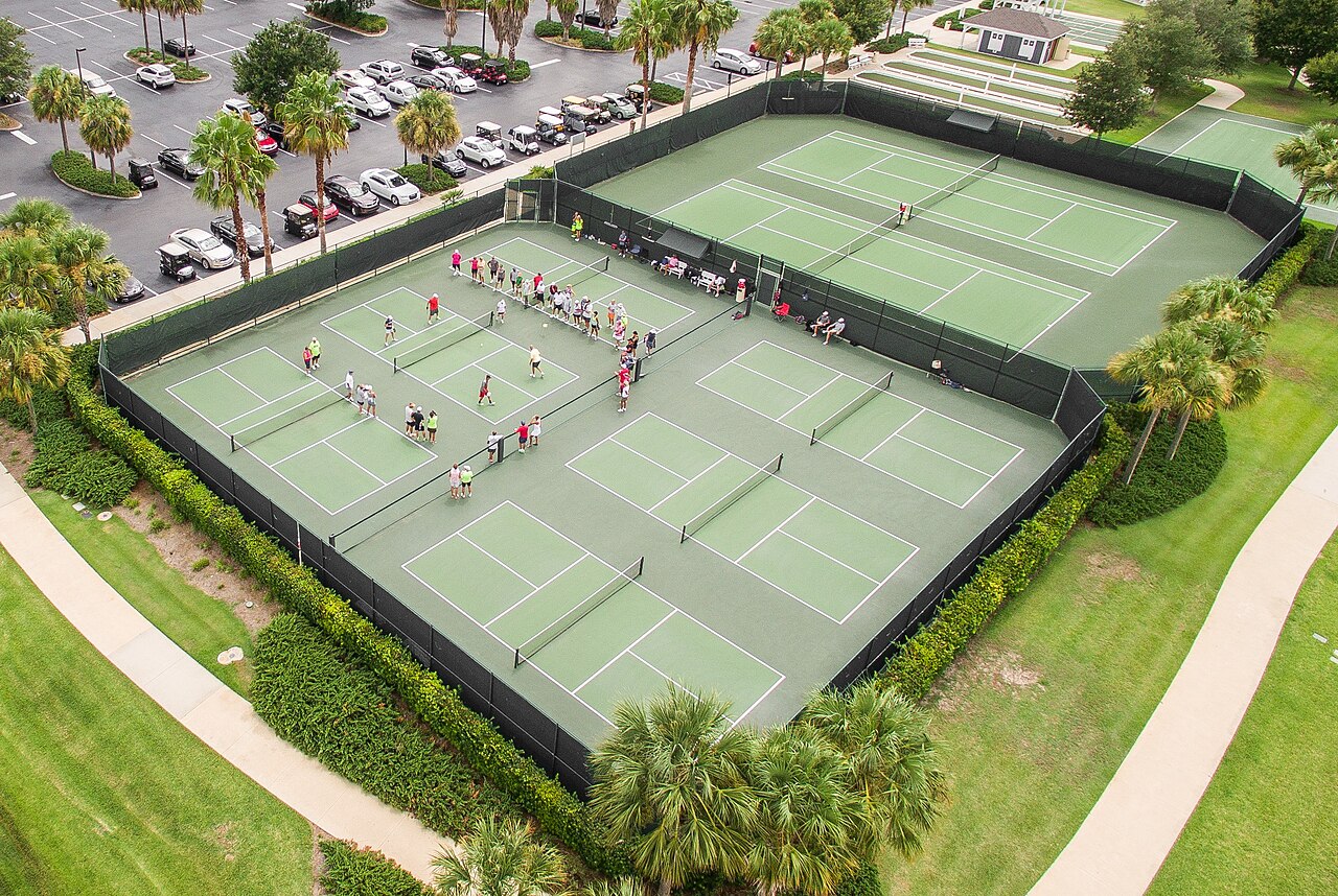Aerial photo of pickleball courts in The Villages. Reference photograph; not represented as the Miami story venue or its named subjects..